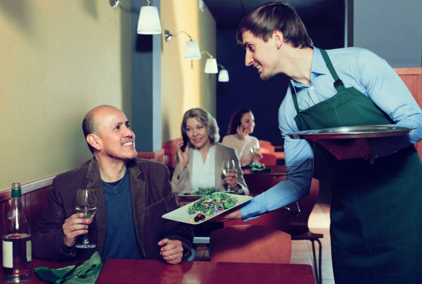 istock Waiter and mature man in restaurant 971514512
