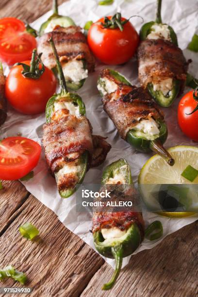 Jalapeno Peppers Wrapped In Bacon And Stuffed With Cream Cheese Closeup Vertical Stock Photo - Download Image Now