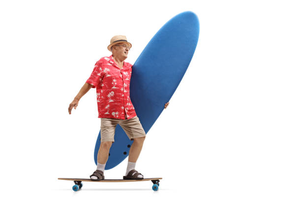 istock Elderly tourist holding a surfboard and riding a longboard 971530054