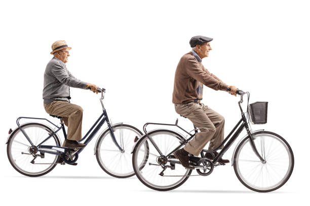 istock Two elderly gentlemen riding bicycles 971530172