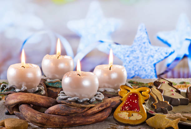istock Advent Wreath with Burning Candles on the Table 971532232