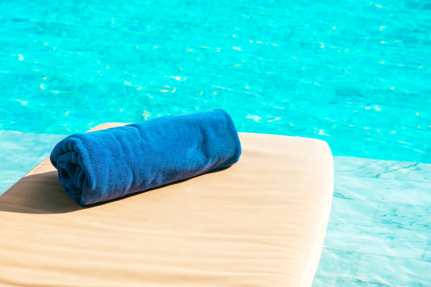 Rolled towel placed on the bed in the pool.