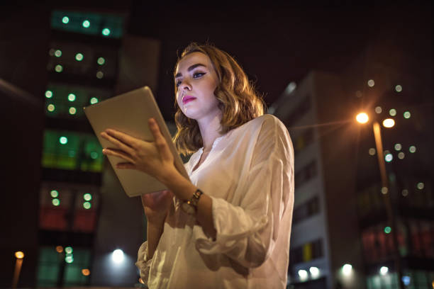 istock Serious businesswoman working outdoors on a digital tablet 971545022