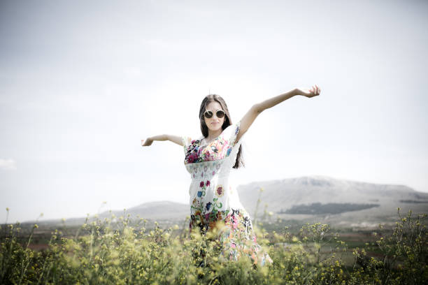 istock a young woman in the spring 971546120