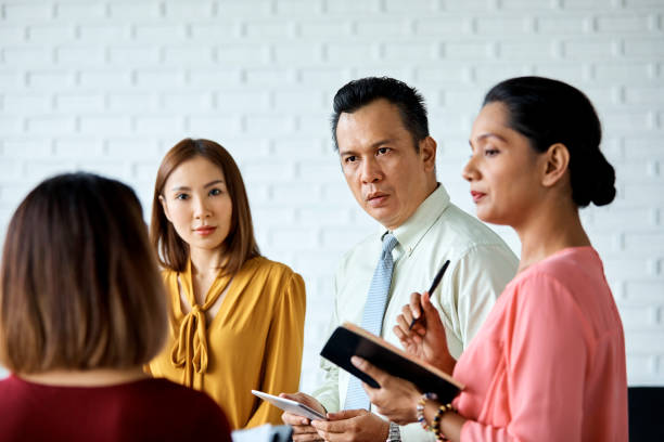istock Serious businessman planning with colleagues 971546200
