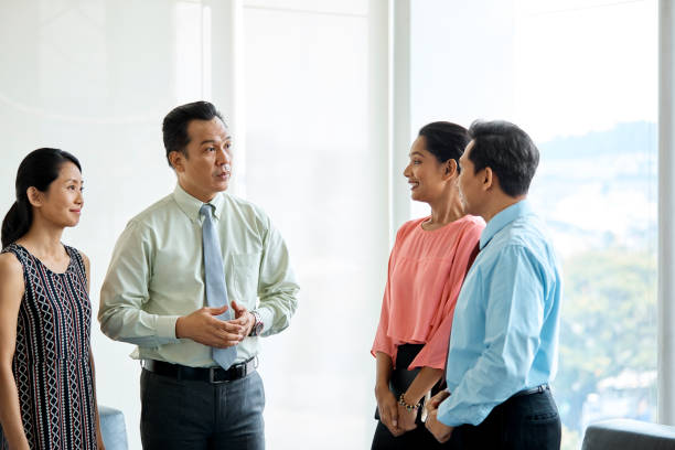 istock Confident business team discussing in office 971546252