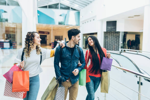 istock Smiling friends on shopping in depertment store 971552712