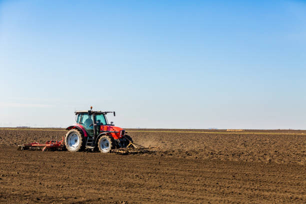 istock Farmer in tractor preparing land with seedbed 971565270