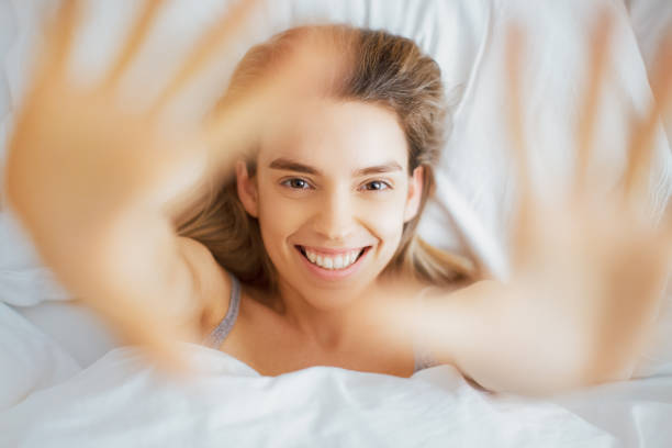 istock Young woman on bed 971567502