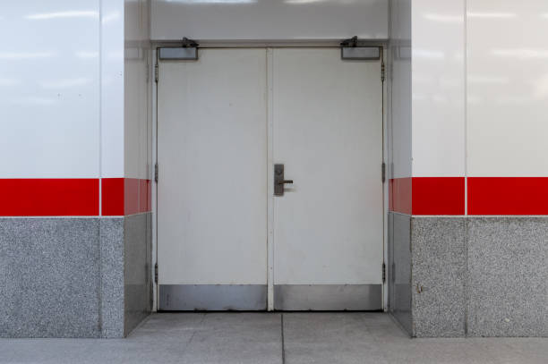istock sidewalk by street wall & door 971568226