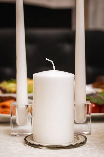 istock Candles close up standidng at the wedding table 971578674
