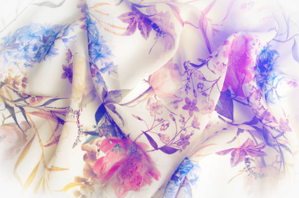 istock Texture, background, pattern. Silk fabric. Texture with pink and yellow flowers in watercolor technique. Wallpapers with roses, daisies and mimosa. Greeting card. Silk scarf, shawl. Holidays. 971583136