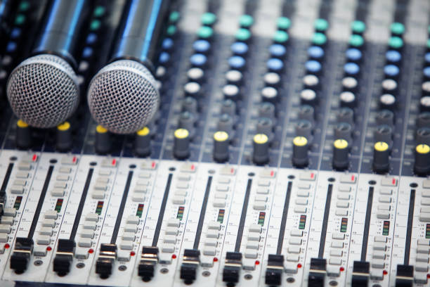 istock microphone with audio sound mixer background 971593118