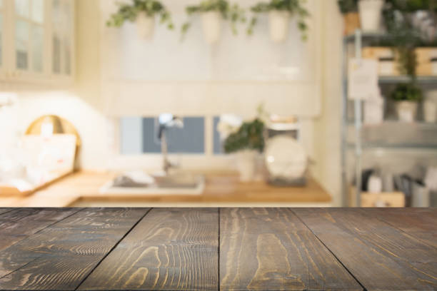 istock Blurred background. Modern defocused pastel kitchen with wooden tabletop and space for you. 971593242
