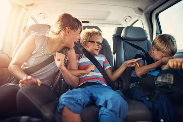 istock Happy kids travelling by car 971610540