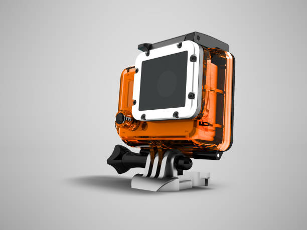istock Action camera in an orange case for helmet mount 3d render on gray background with shadow 971617652