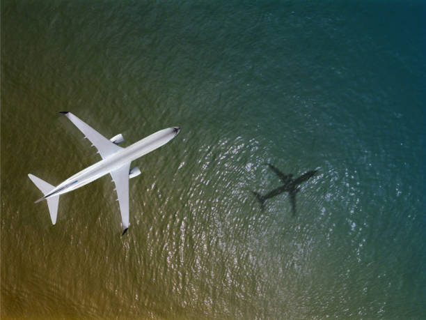 istock Airplane flies over a sea, View from above 971617906