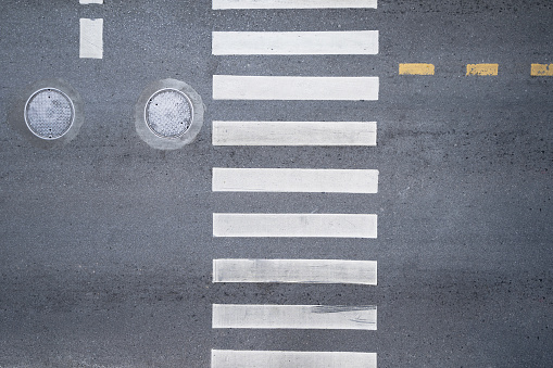 Aerial photo top view over pedestrian crossing on traffic road