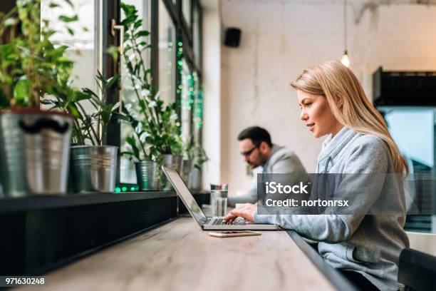 Concentrated Blonde Female Copywriter Working On Creative Task At The Cafe Stock Photo - Download Image Now