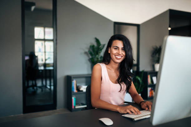 istock Portrait of female manager working on a computer. 971630566
