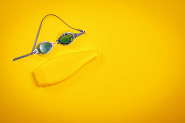 istock background with swimming goggles and sunscreen 971631444