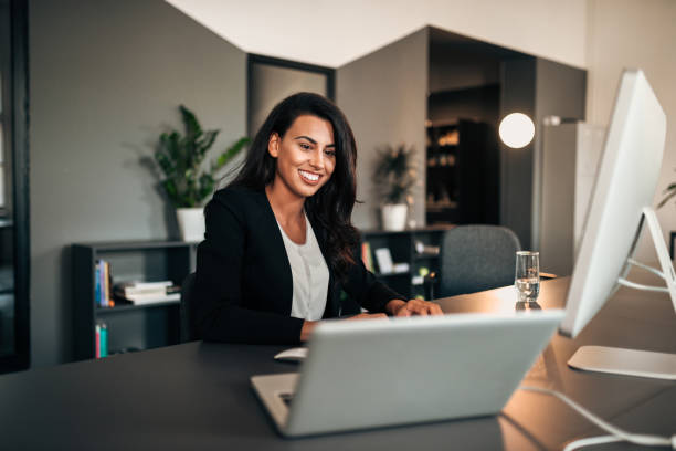 istock Graphic designer working on laptop and desktop pc. 971632222