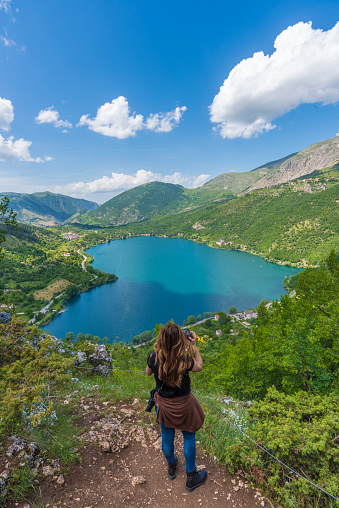 Scanno, Italy - 2 June 2018 - When nature is romantic: the heart - shaped lake on the Apennines mountains, in Abruzzo region, central Italy, in a spring day with tourist