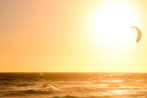istock Surfer at sunset on a calm ocean 971640554
