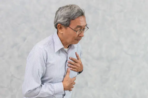 Asian Elder suffer from Chest pain from Heart Attack or Stroke.