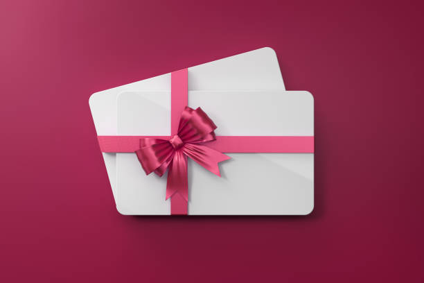 istock White Gift Cards With Pink Bow Tie On Pink Background 971659636