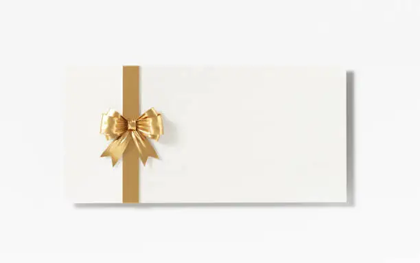 White gift card with gold bow tie on white background. Horizontal composition with clipping path and copy space.