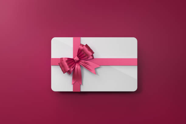 istock White Gift Card With Pink Bow Tie On Pink Background 971659836