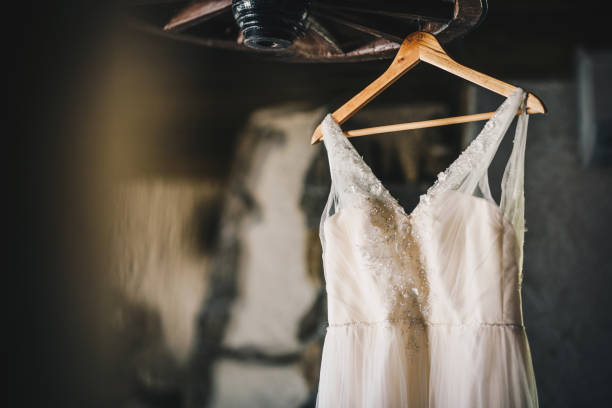 Beautiful wedding dress on a hanger stock photo