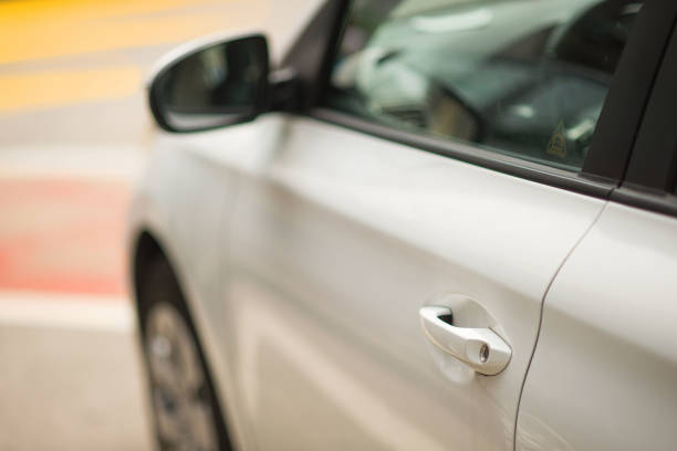 istock A grey-silver car on the road with red-yellow markings. 971666888