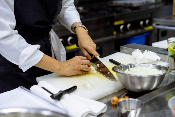 istock Female chef cuts onions 971669822