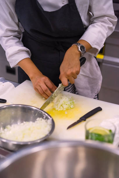 istock Female chef cuts onions 971669842