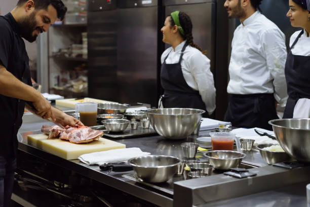 istock the chef describes the techniques of cutting meat 971669942