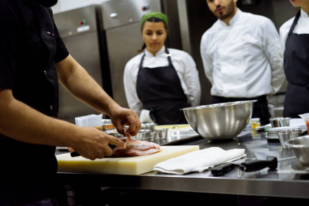 istock the chef describes the techniques of cutting meat 971669944
