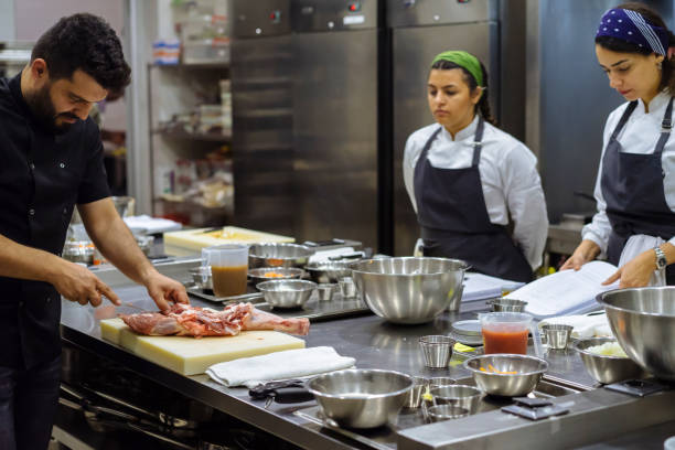 istock the chef describes the techniques of cutting meat 971672226