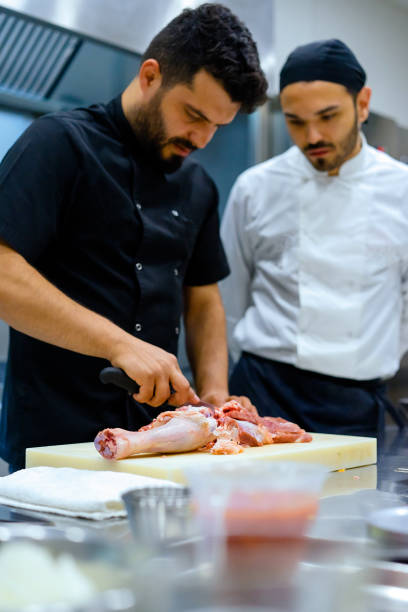 istock the chef describes the techniques of cutting meat 971672268