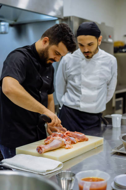 istock the chef describes the techniques of cutting meat 971672308