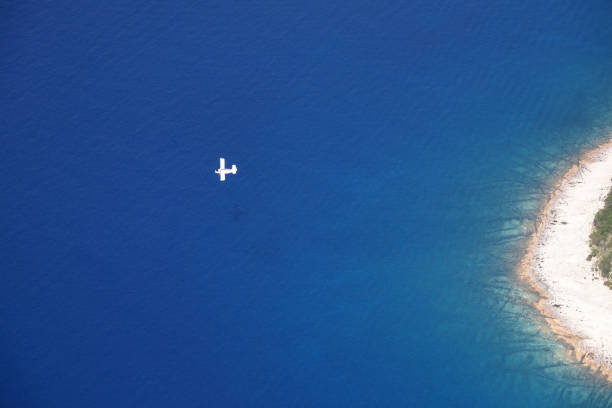 istock Small plane flying over the sea 971672716