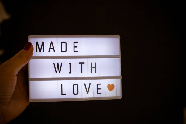 istock Love text written on a light box.Light box night lamp with Made with love. Can be placed in different locations, with a more romantic and more creative way to attract attention. 971673000