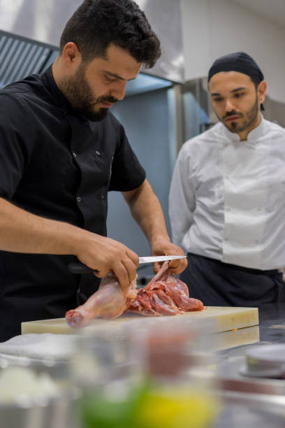 istock the chef describes the techniques of cutting meat 971673198