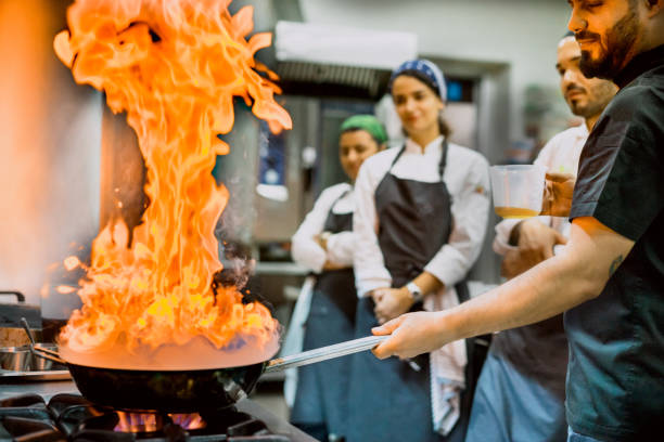 istock Master chef cooking chicken in framing pan 971678896