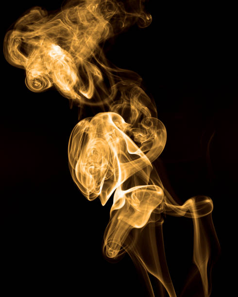 istock Smoke rising against black background 971682640