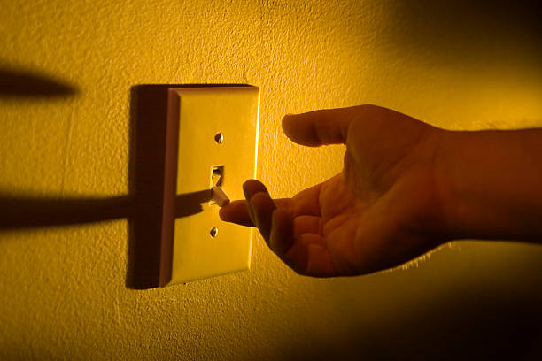 Turning on the lights stock photo