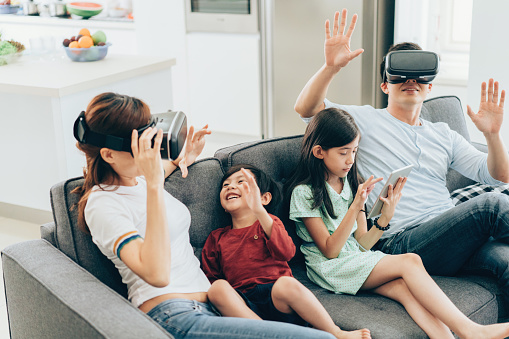 Family having fun with VR simulator