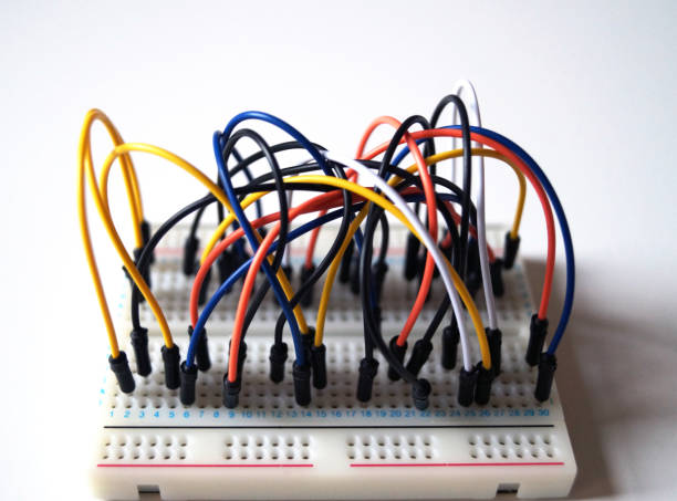 istock Wires pluged in to a breadbaord. 971703906