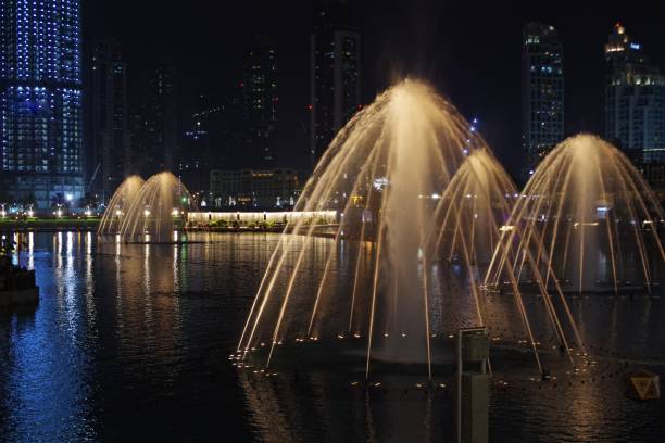 istock Beautiful fountain at night, romantic background. 971710660